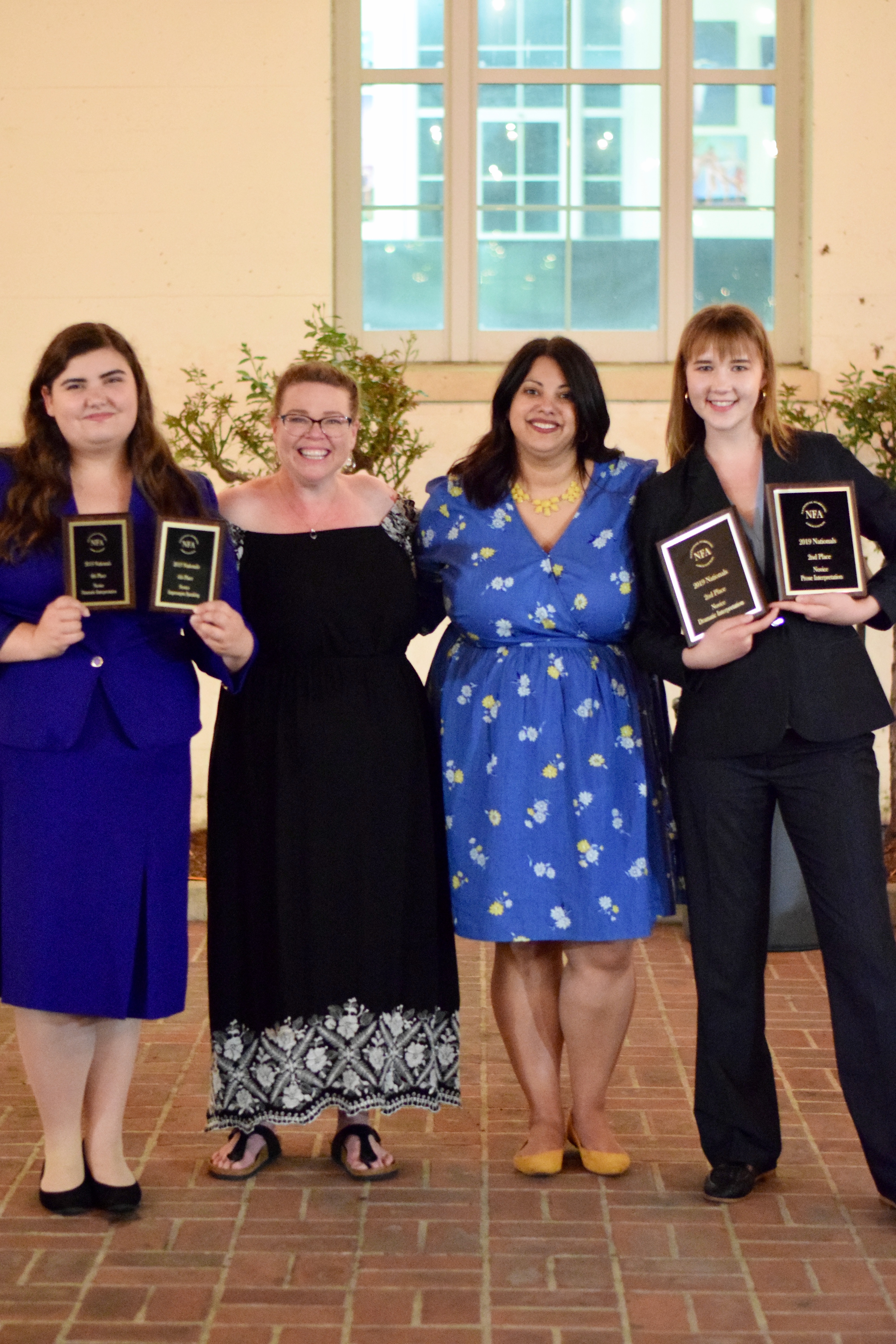 Celebrating the team’s successes are Misty Morin (from left), Nance Riffe, Tanya Melendez and Sam Darwin.